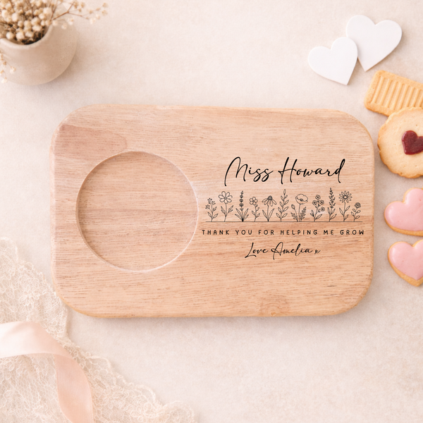 Wooden tray with engraved message on a light background