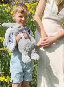 Page boy holding grey 14" rabbit teddy with white inner ear and black vinyl personalisation