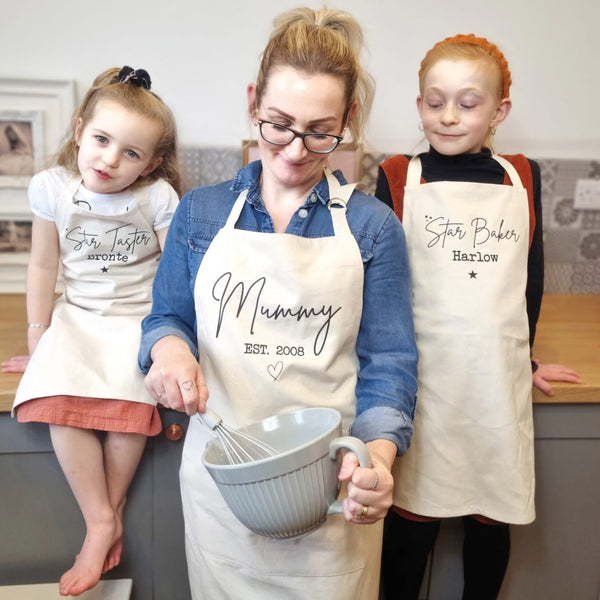 Mum and two daughters with matching personalised aprons