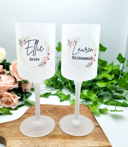 Two beautiful frosted wine glasses with gold hexagon with pink flower