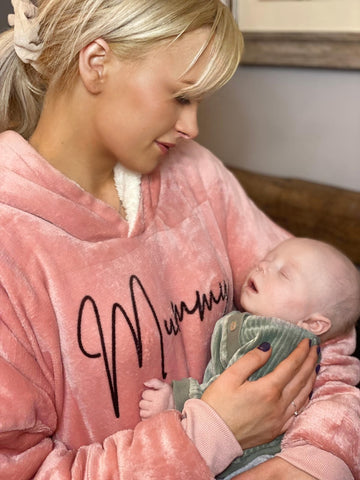 Mother holding baby wearing pink personalised mummy sherpa